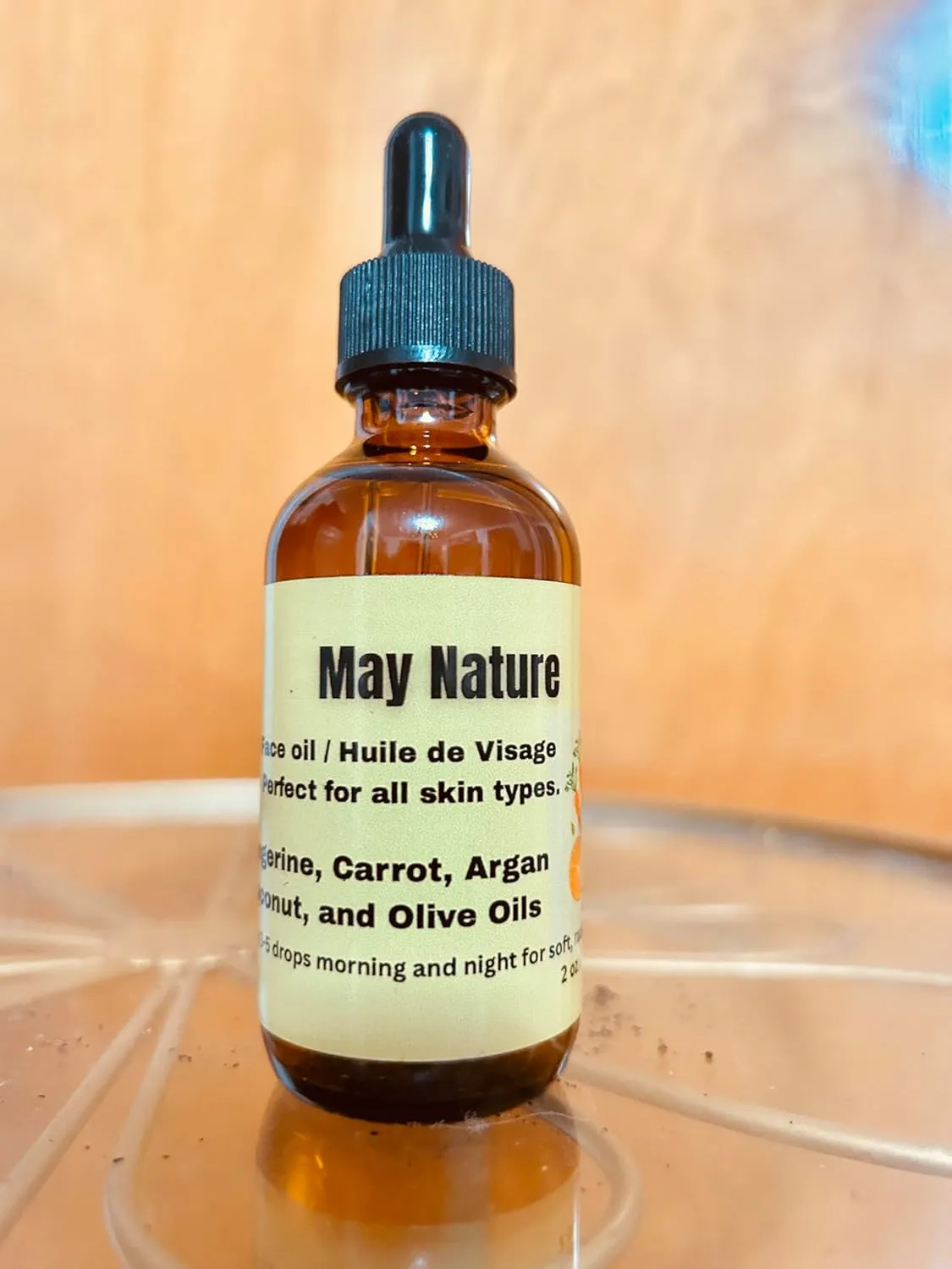 Face Oil/Huile de Visage A nourishing blend of tangerine, coconut, and olive oils that hydrates, softens, and restores your natural glow—perfect for daily use on all skin types.