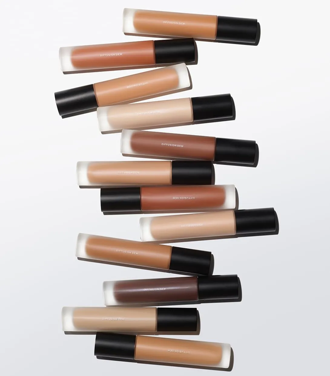 MAKE Beauty Diffusion Dew Skin Tint. Sheer to Medium Coverage Radiant Finish. Blurring, Smoothing, and Brightening for Glowing Complexion. Enhanced with Niacinamide and Adenosine. Espresso 20